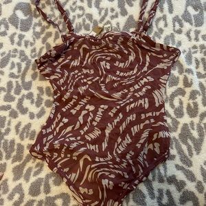 - Skims bodysuit